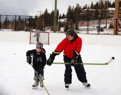 Skaters on an outdoor hockey rink in Red Deer